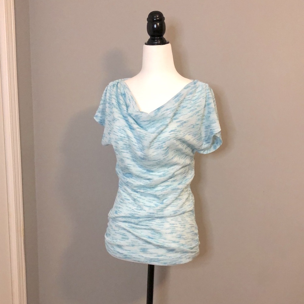 San Francisco turquoise and white top.